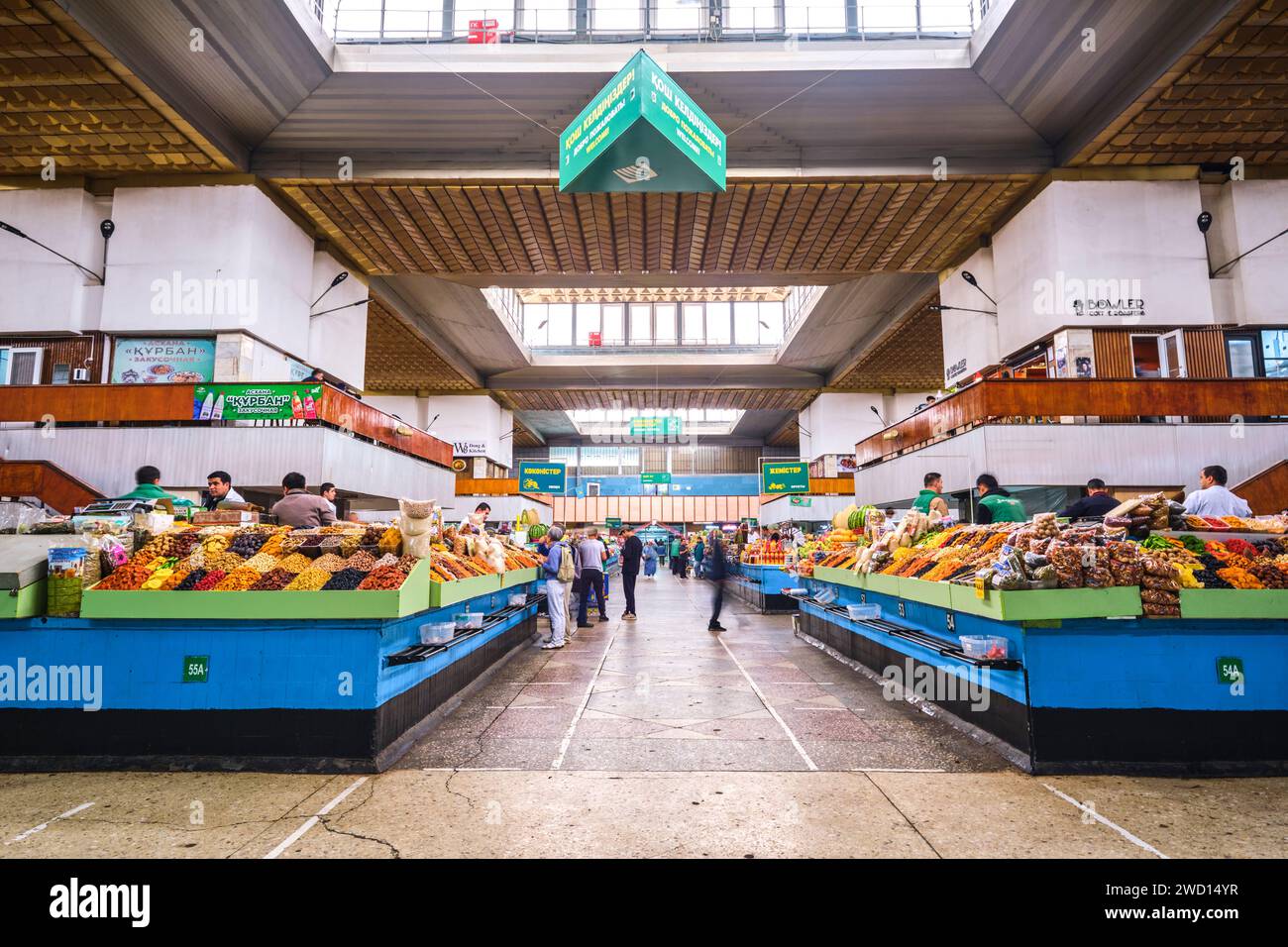 Various vendors and stalls selling dried fruit products and nuts. At the main local, Soviet era food market, the Green Bazaar. In Almaty, Kazakhstan. Stock Photo