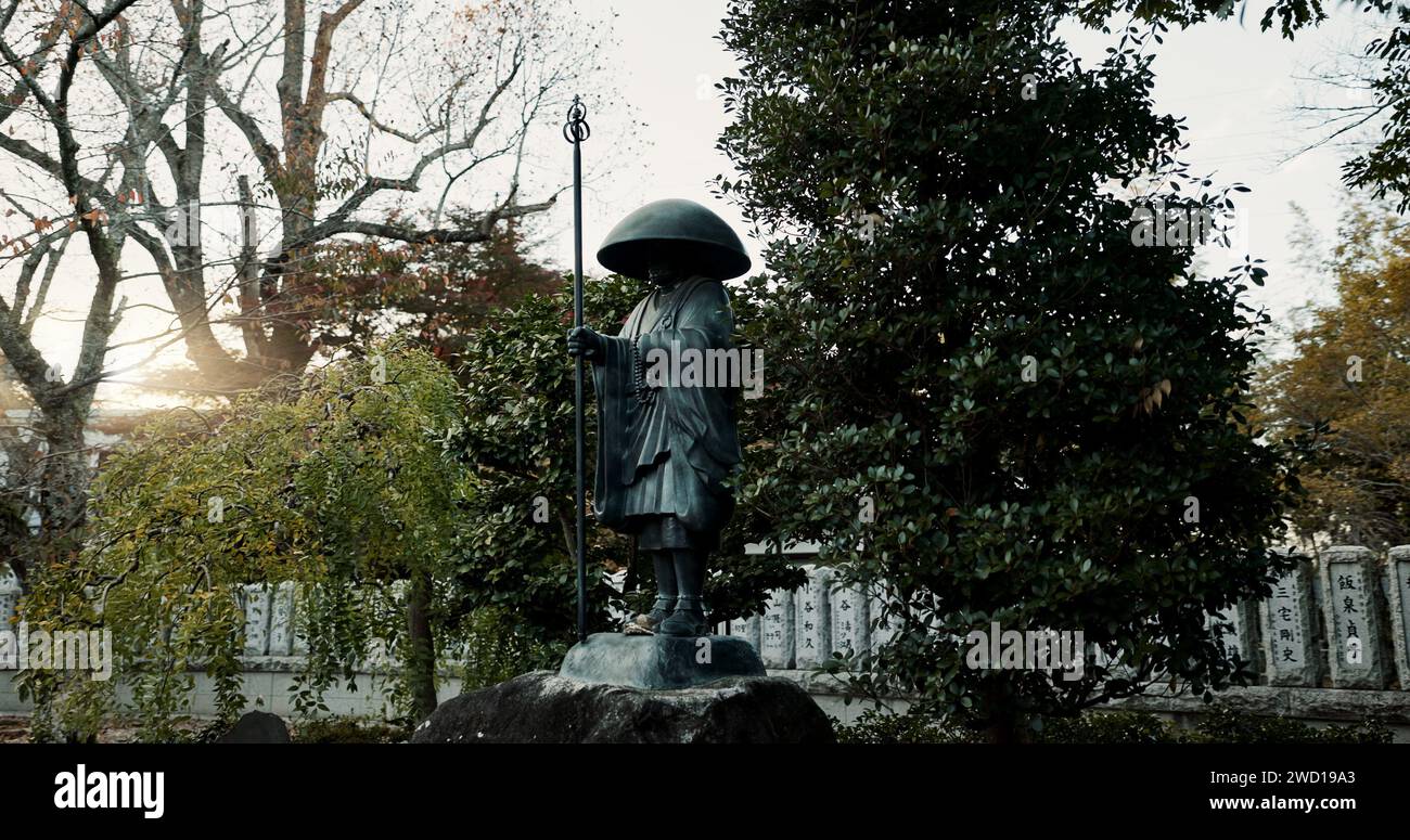 Japan, warrior and statue in nature or outdoor cemetery for honor, tradition or culture. Structure of old soldier or historical Fushimi Inari Taisha Stock Photo