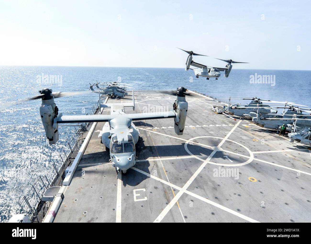 An MV-22 Osprey takes off from the flight deck of USS Somerset. Stock Photo