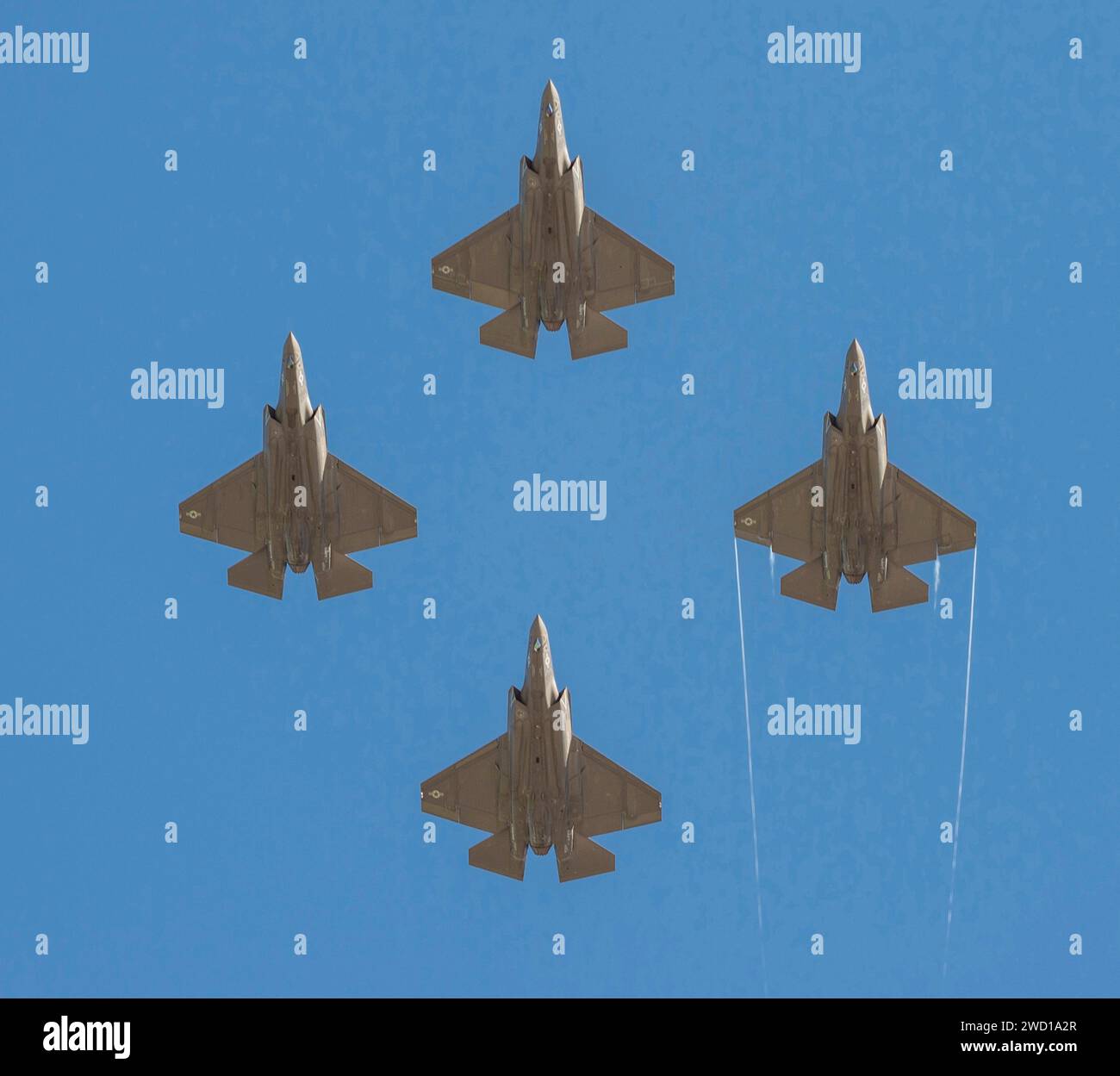 Four F-35C Lightning II joint strike fighters fly in formation. Stock Photo