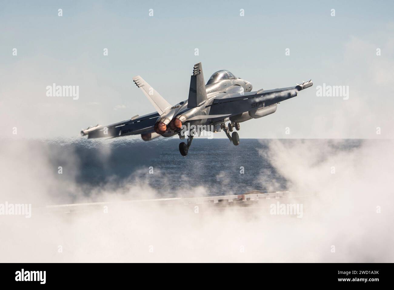 An E/A-18G Growler launches from the aircraft carrier USS George H.W. Bush. Stock Photo