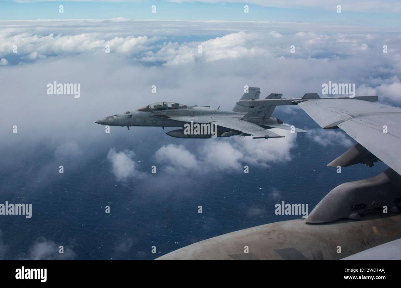 An F/A-18F Super Hornet flies over the Philippine Sea. Stock Photo