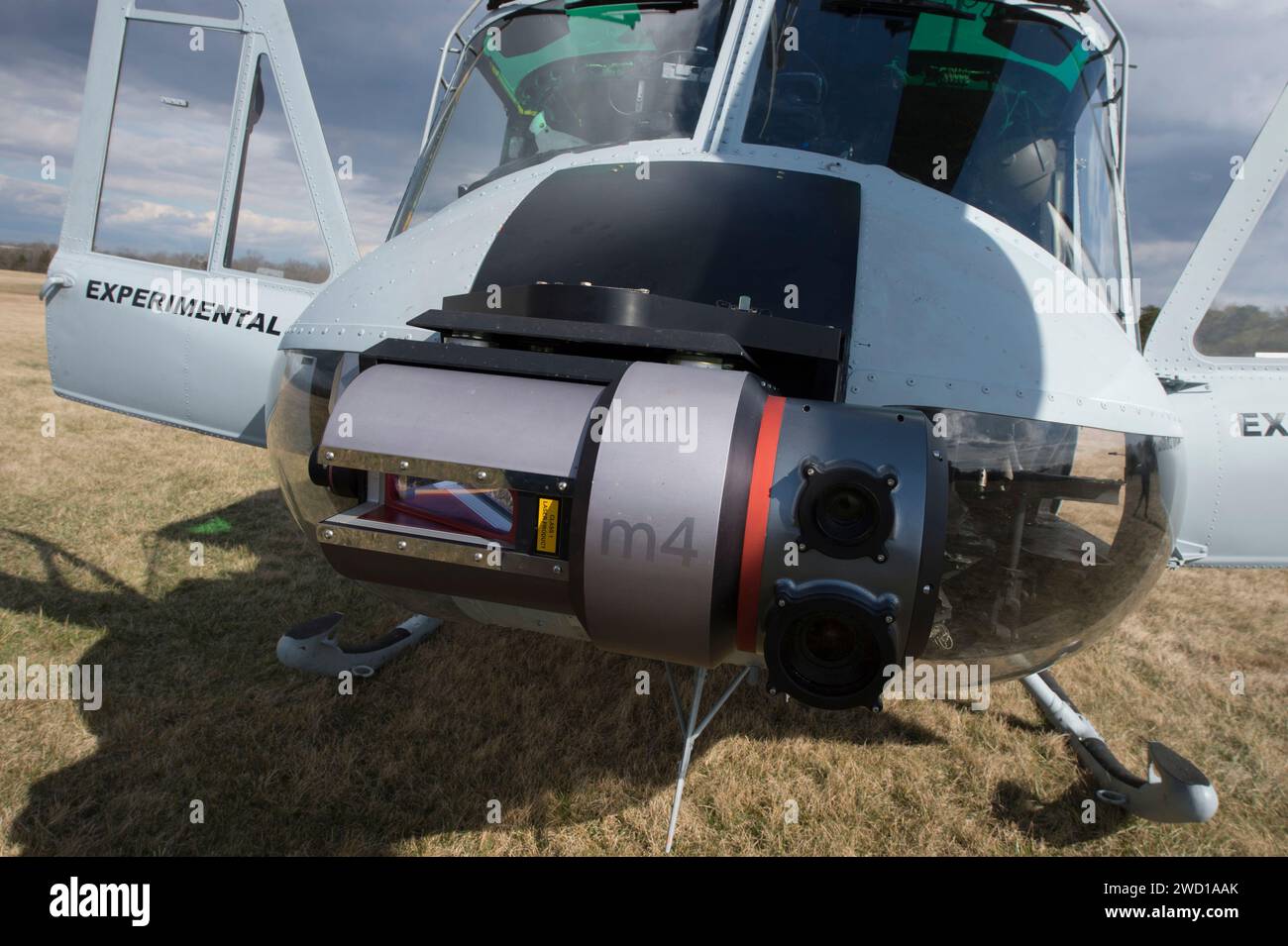 A UH-1 Huey equipped with an Autonomous Aerial Cargo/Utility System. Stock Photo