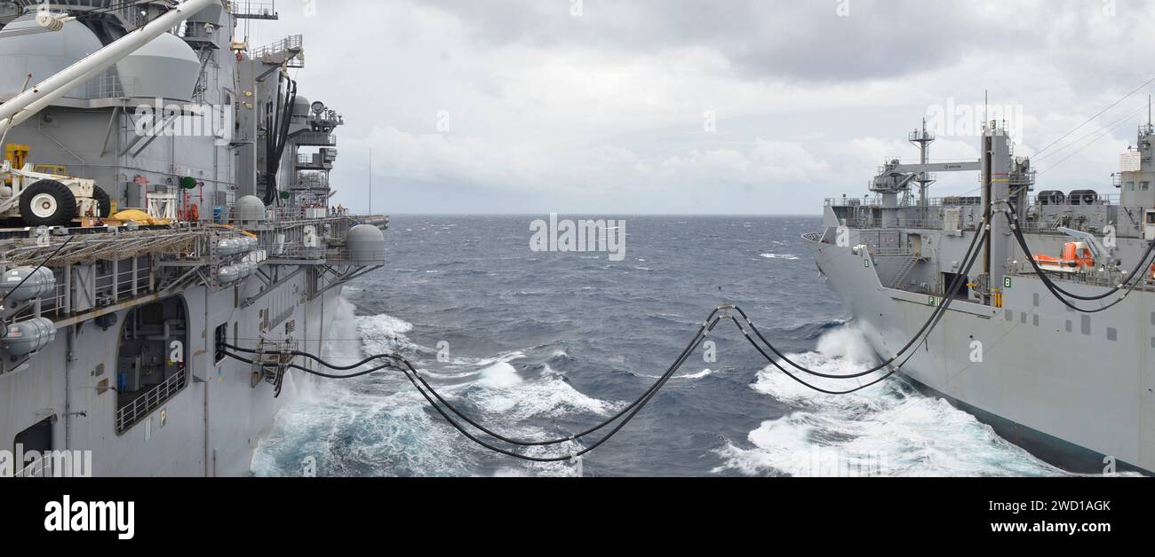 Dry cargo ship USNS William McLean delivers fuel to the amphibious ...