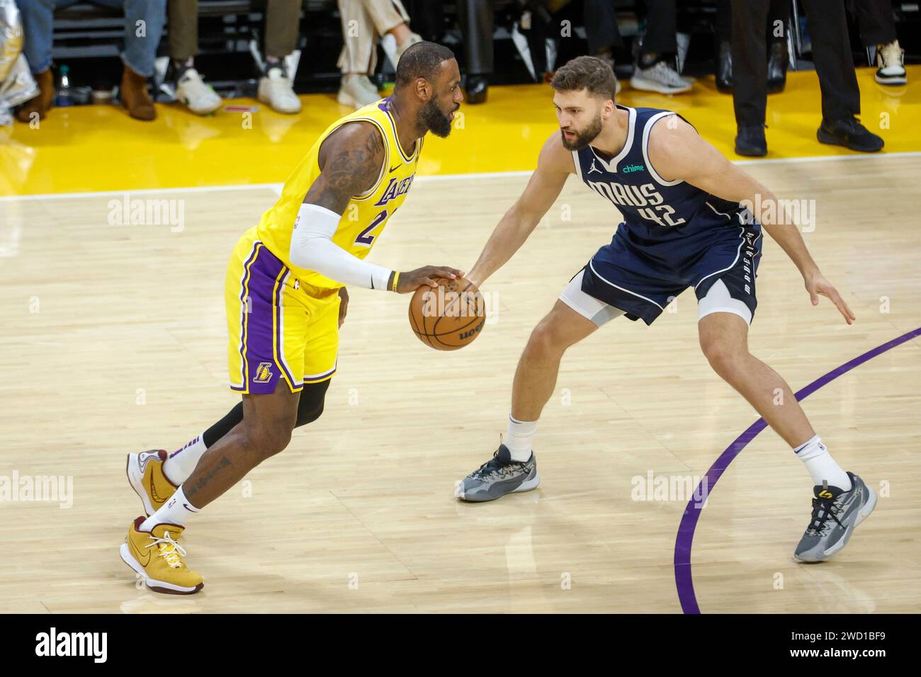 Los Angeles, United States. 17th Jan, 2024. Los Angeles Lakers' LeBron James (L) and Dallas Mavericks' Maxi Kleber (R) seen in action during the NBA basketball game between Los Angeles Lakers and Dallas Mavericks at Crypto.com Arena. Final score; Los Angeles Lakers 127:110 Dallas Mavericks. Credit: SOPA Images Limited/Alamy Live News Stock Photo