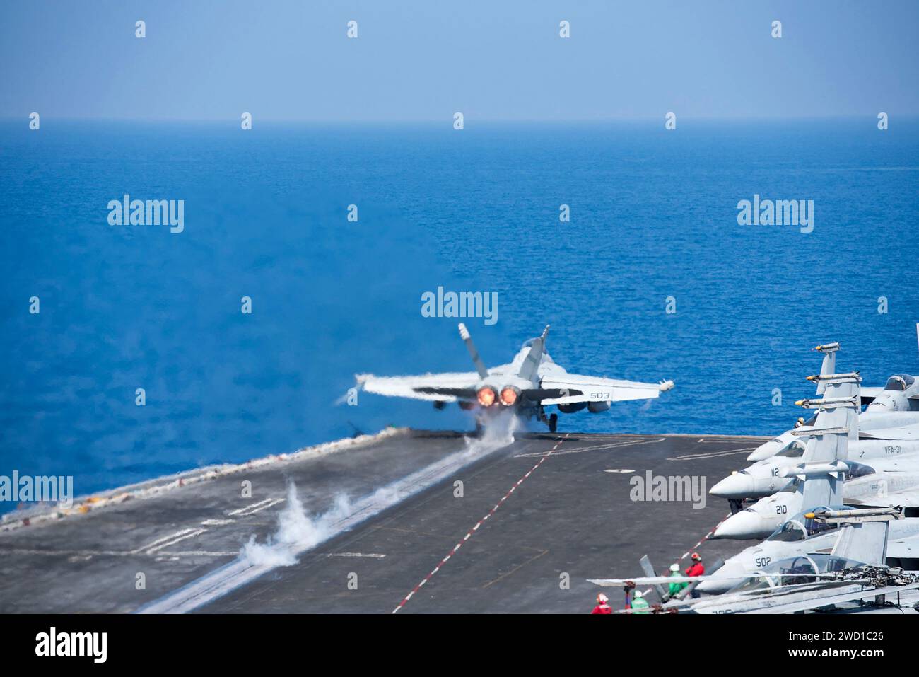 An EA-18G Growler launches off the aircraft carrier USS George H.W. Bush. Stock Photo