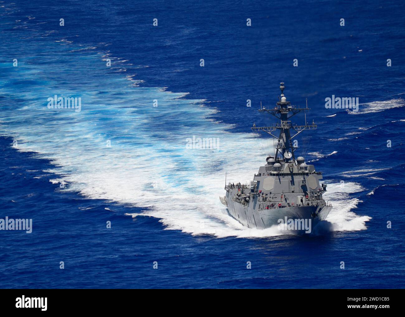 The Arleigh Burke-class destroyer USS Shoup transits the Pacific Ocean. Stock Photo