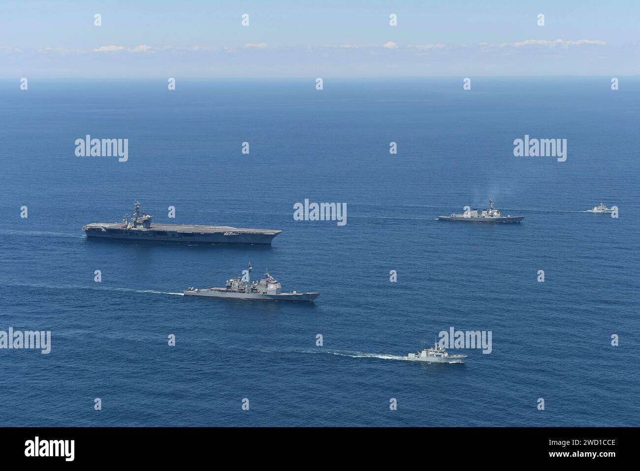 A group of U.S. Navy ships and Royal Canadian Navy ships transit the