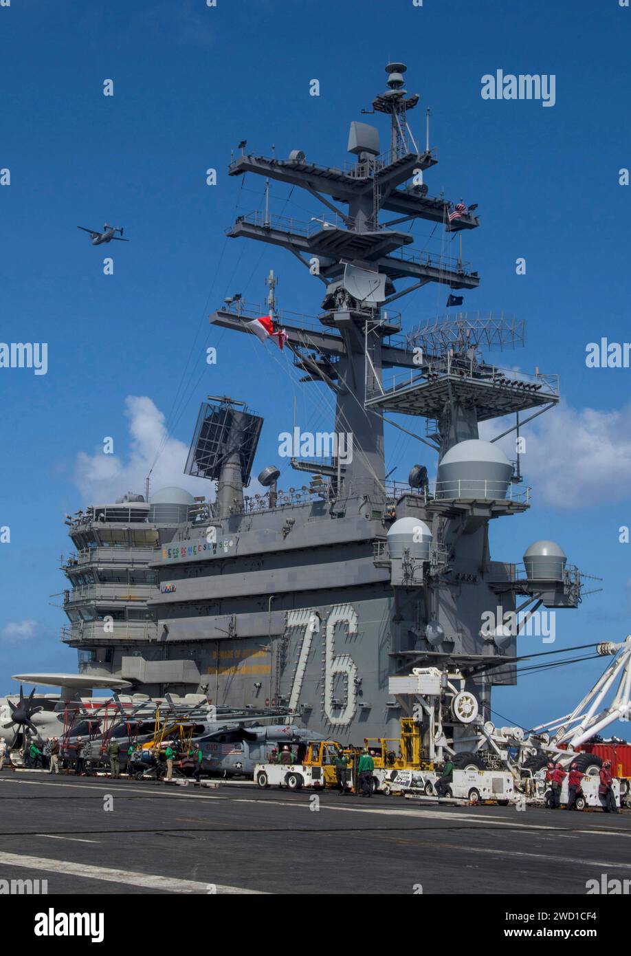 A C-2A Greyhound flies over the aircraft carrier USS Ronald Reagan. Stock Photo