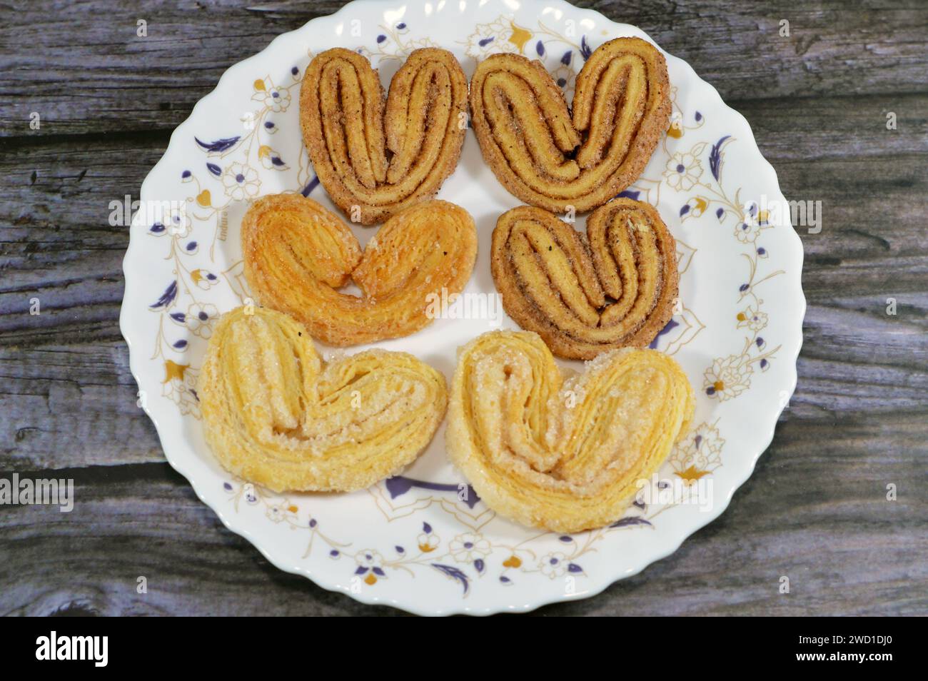 palmier, short for feuille de palmier 'palm tree leaf, French hearts