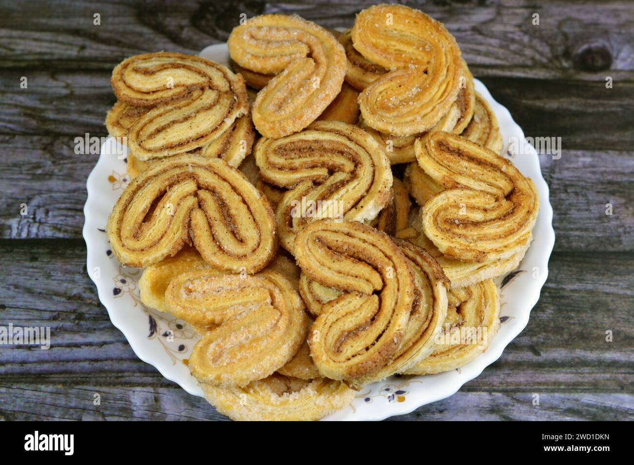 palmier, short for feuille de palmier 'palm tree leaf, French hearts