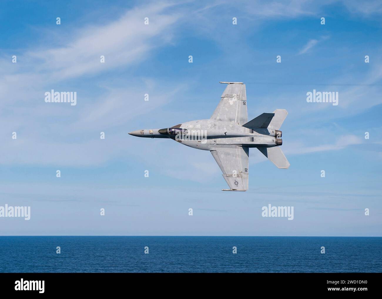 An F/A-18E Super Hornet flying over the Atlantic Ocean. Stock Photo