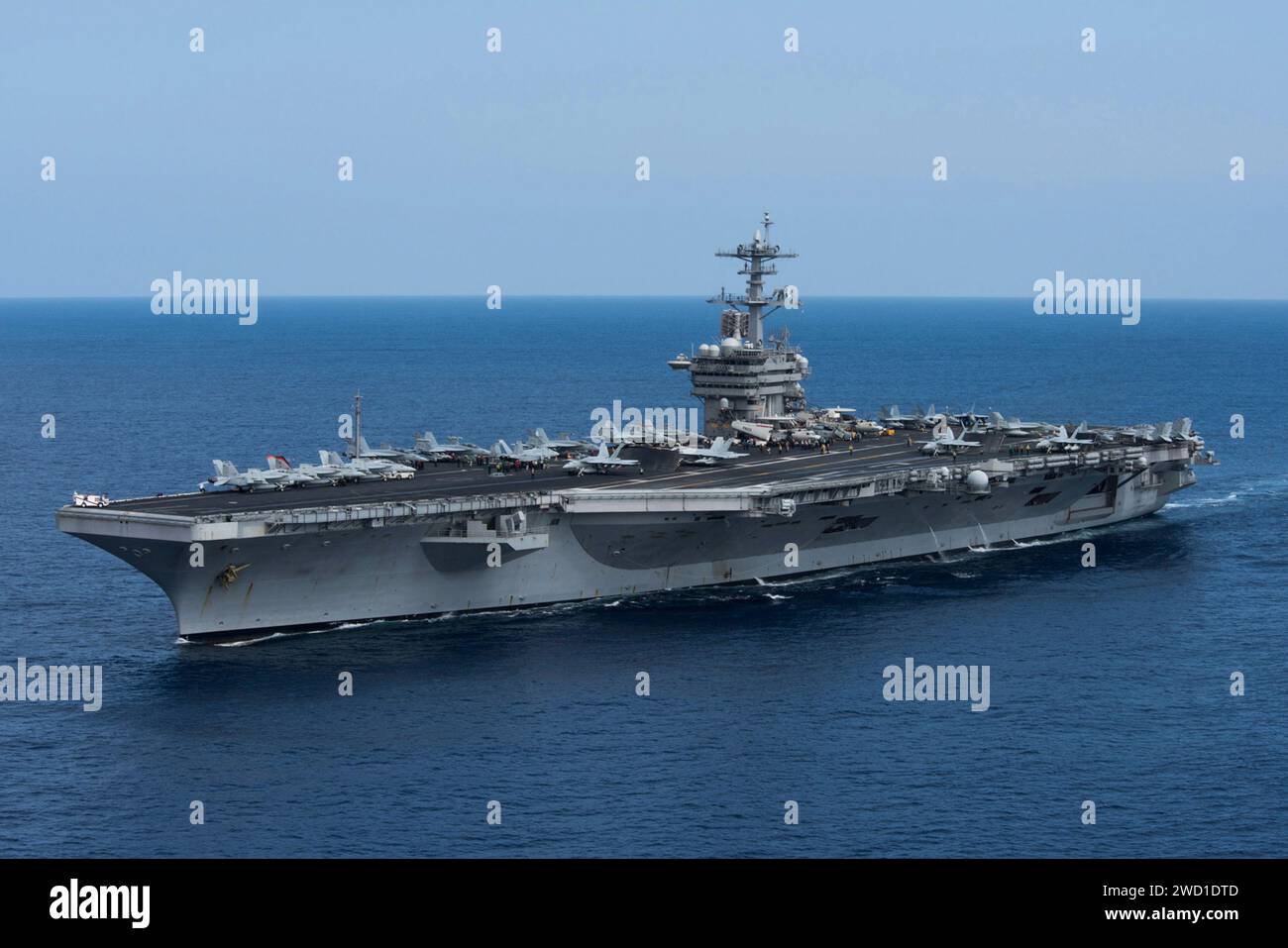 The aircraft carrier USS Theodore Roosevelt transits the Pacific Ocean. Stock Photo