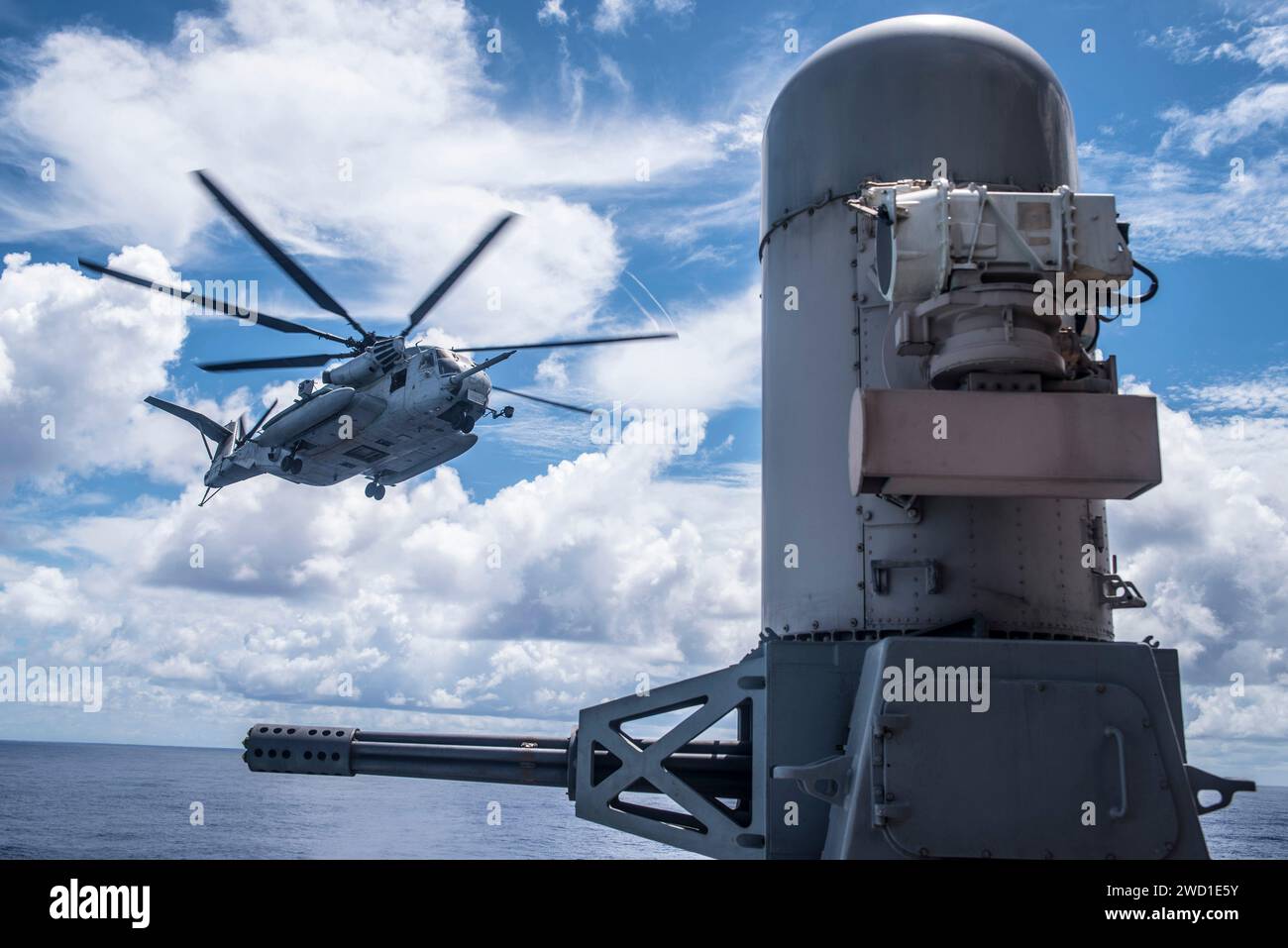 A CH-53E Super Stallion helicopter approaches USS Bonhomme Richard. Stock Photo