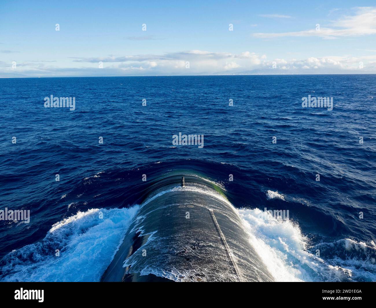 The Ohio-class ballistic missile submarine USS Nebraska transits the open ocean. Stock Photo