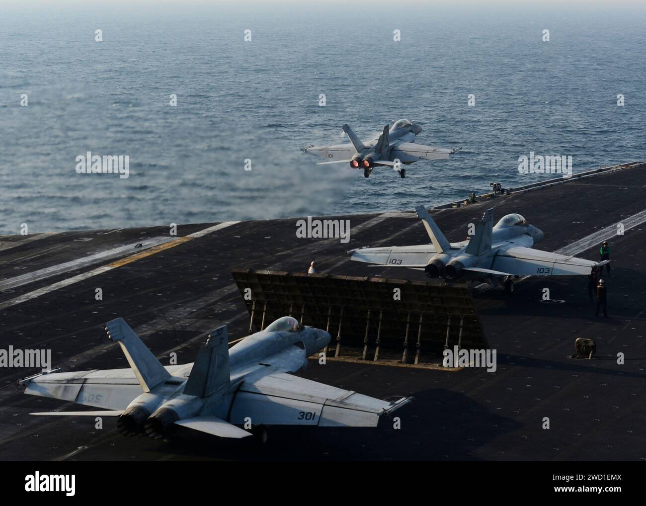 An F A 18F Super Hornet Takes Off From The Flight Deck Of The Aircraft an-f-a-18f-super-hornet-takes-off-from-the-flight-deck-of-the-aircraft