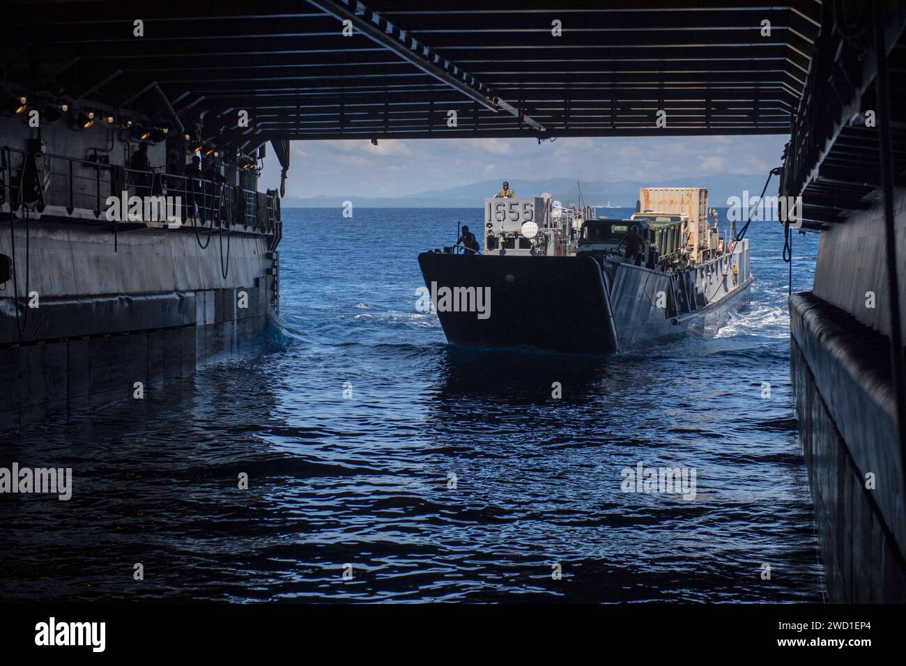 Landing Craft Unit enters the well deck of the dock landing ship USS Oak Hill. Stock Photo