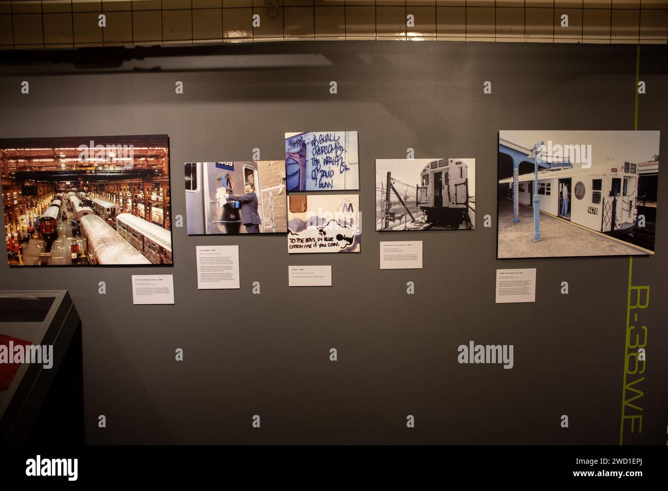 A closeup of exhibited collection of photographs on the walls of New York subway station Stock Photo