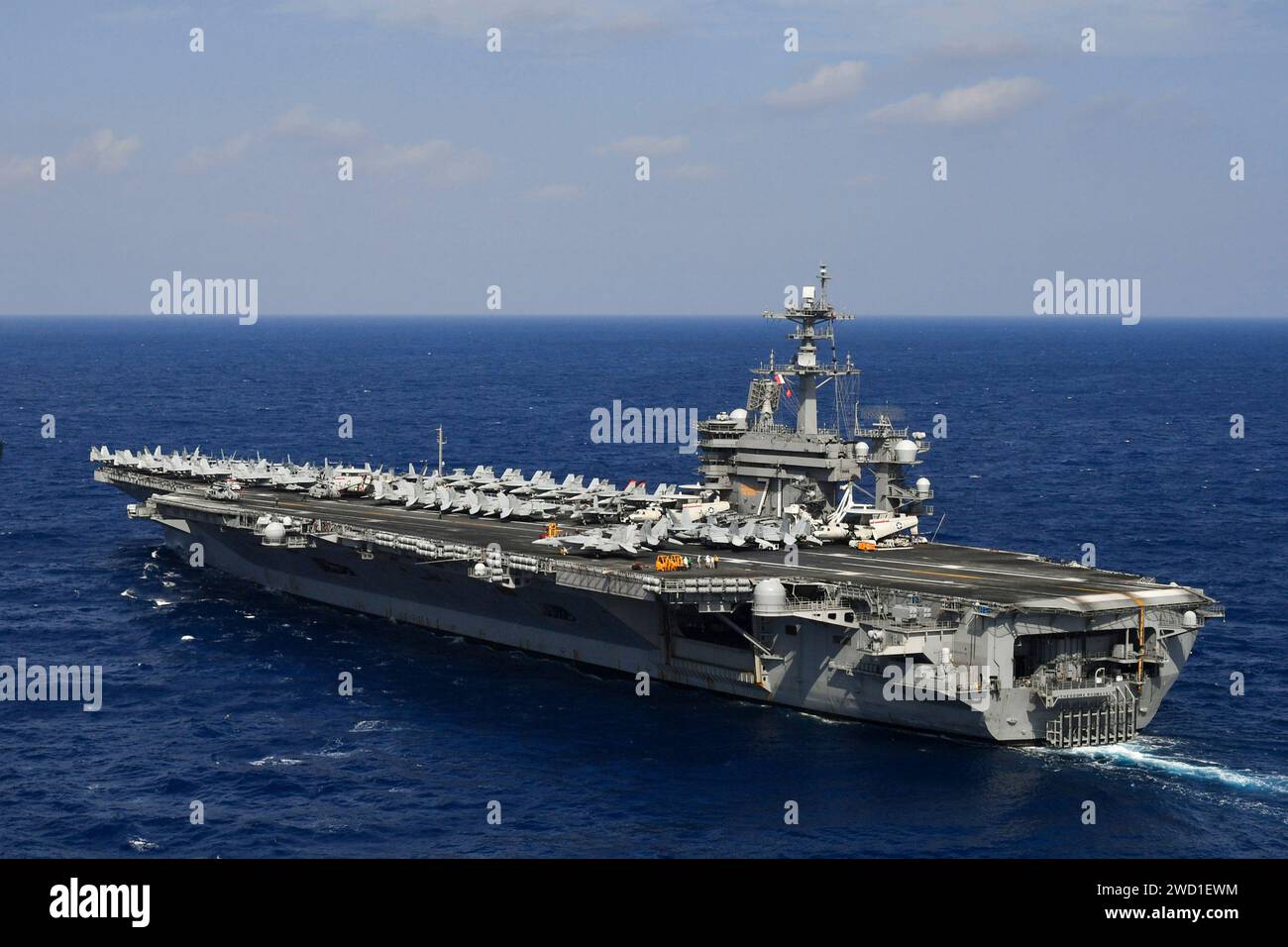 The aircraft carrier USS Theodore Roosevelt transits the Pacific Ocean ...