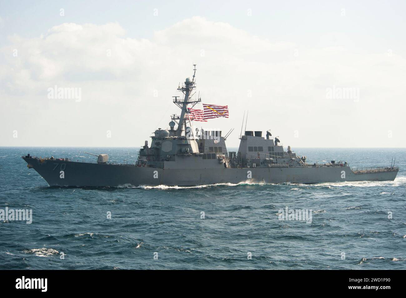 The Arleigh Burke-class guided-missile destroyer USS Hopper transits the Arabian Gulf. Stock Photo