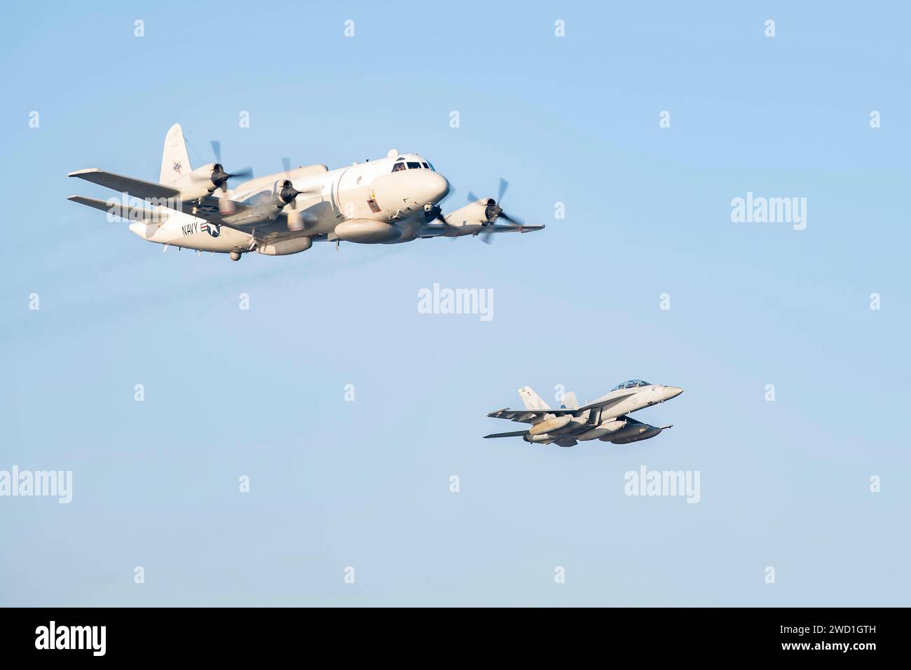 An EP-3 Aries and an F/A-18F Super Hornet in flight. Stock Photo