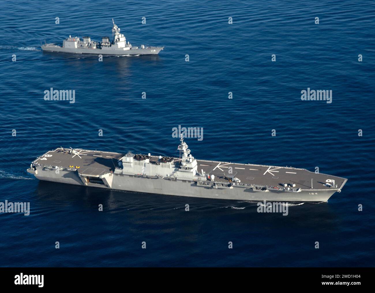 Japan Maritime Self-Defense Force helicopter destroyer JS Kaga and U.S. Navy ship USNS Tippecanoe. Stock Photo