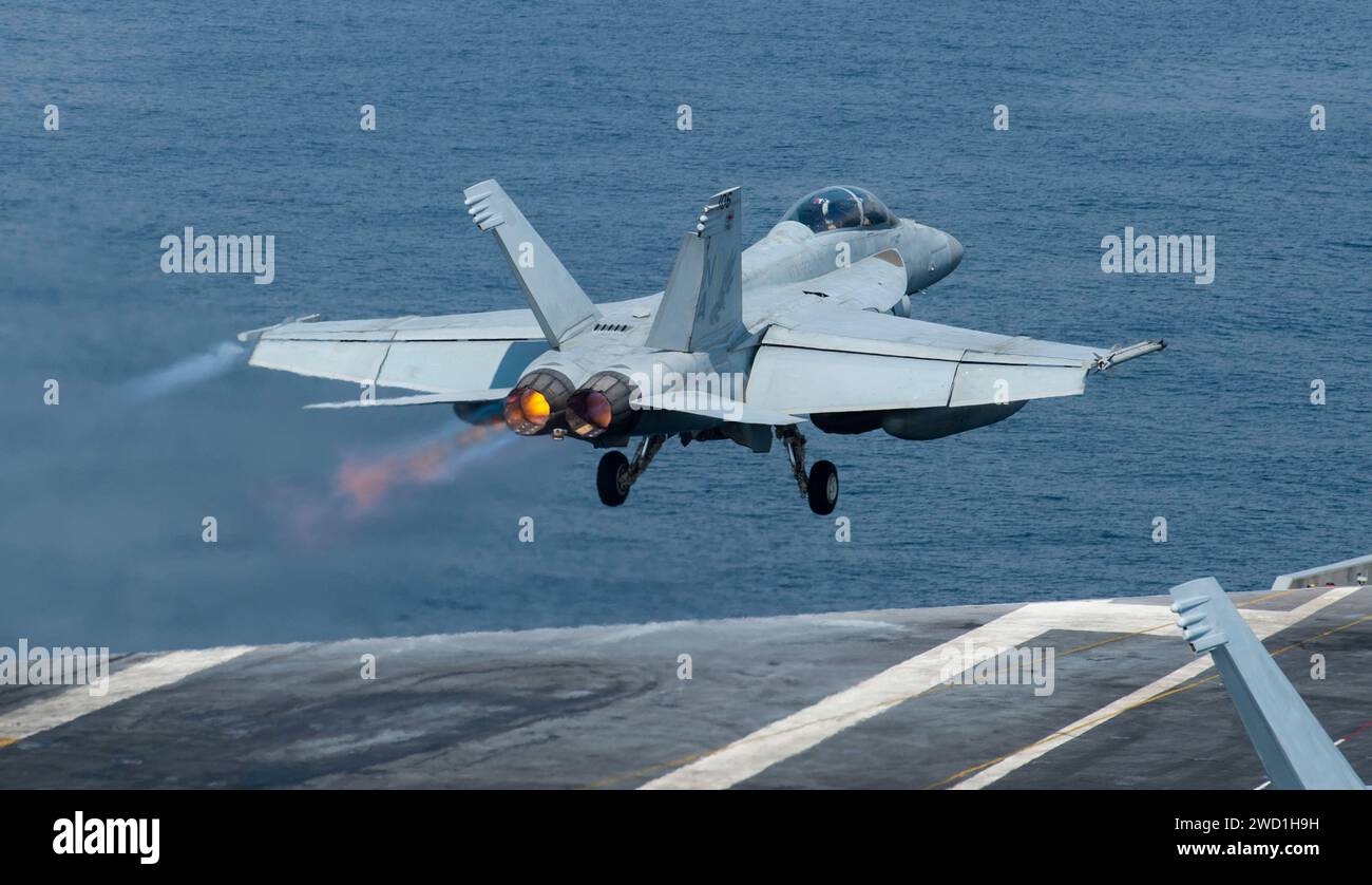 An F A 18F Super Hornet Launches Off The Flight Deck Of The Aircraft an-f-a-18f-super-hornet-launches-off-the-flight-deck-of-the-aircraft