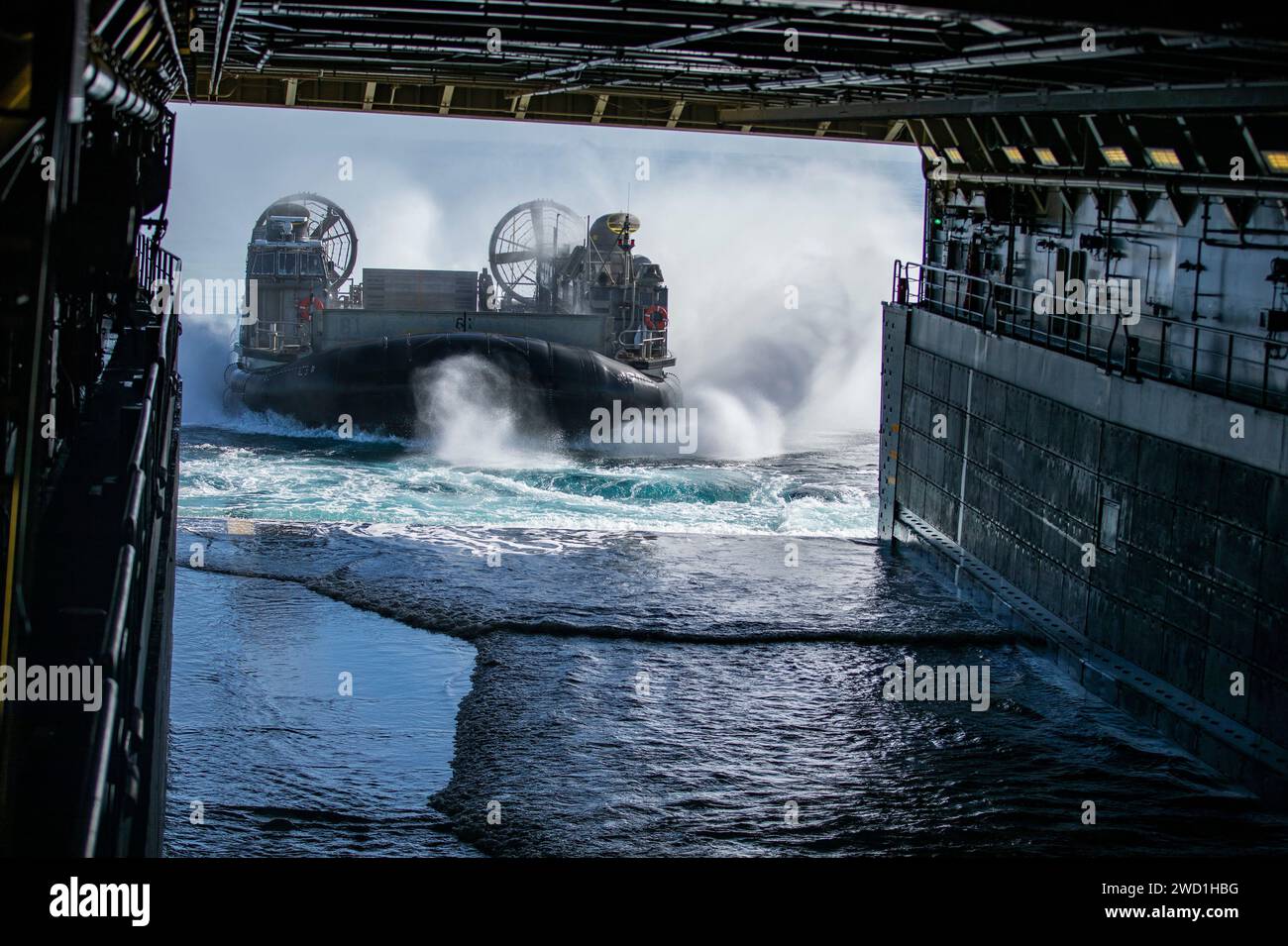 A Landing Craft Air Cushion embarks the landing platform dock ship USS Portland. Stock Photo