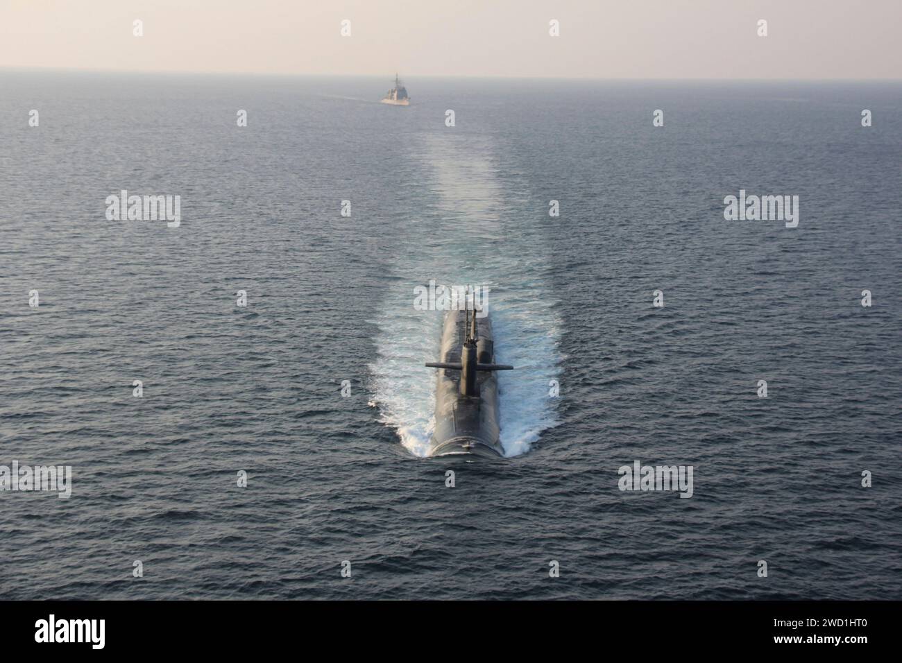 Guided-missile submarine USS Georgia transits the Strait of Hormuz with USS Philippine Sea. Stock Photo