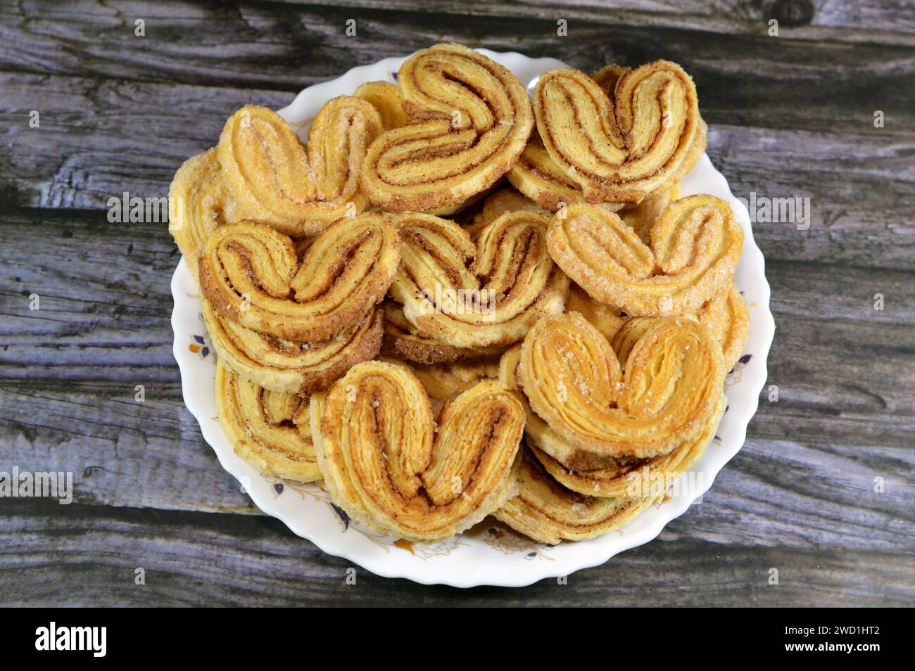 palmier, short for feuille de palmier 'palm tree leaf, French hearts