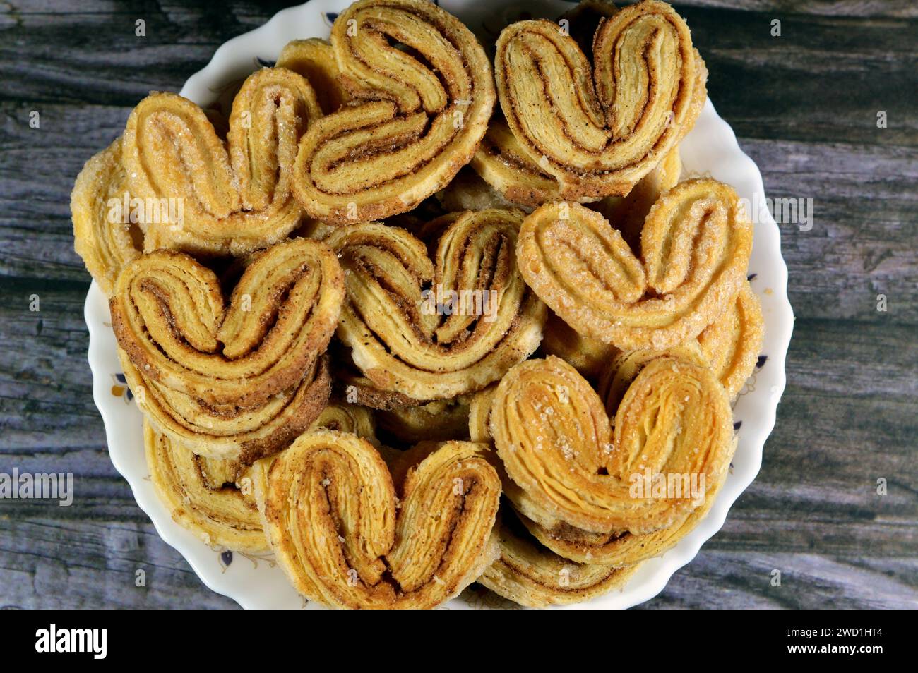 palmier, short for feuille de palmier 'palm tree leaf, French hearts