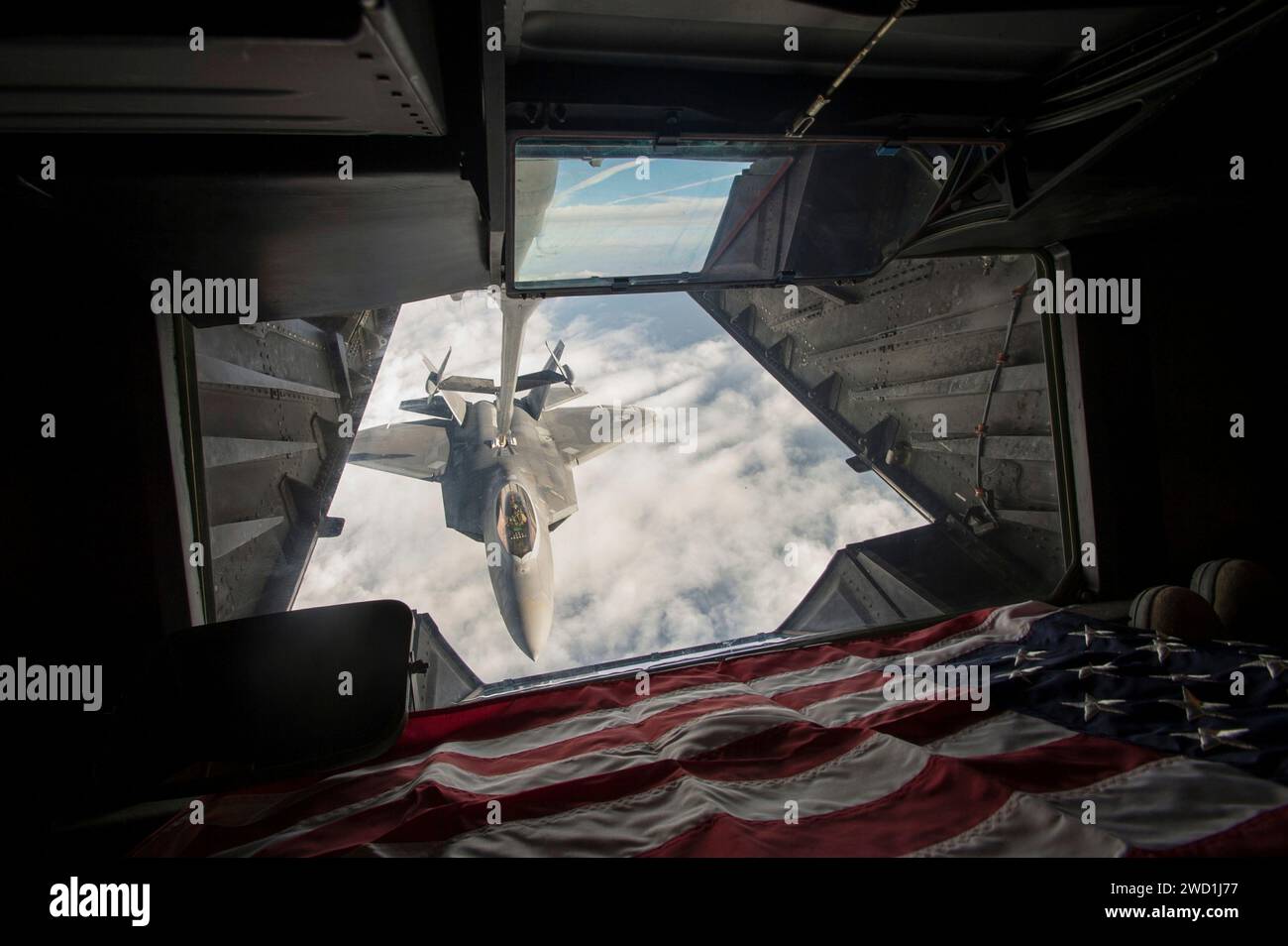 U.S. Air Force F-22 Raptor receives fuel from a KC-10 Extender. Stock Photo