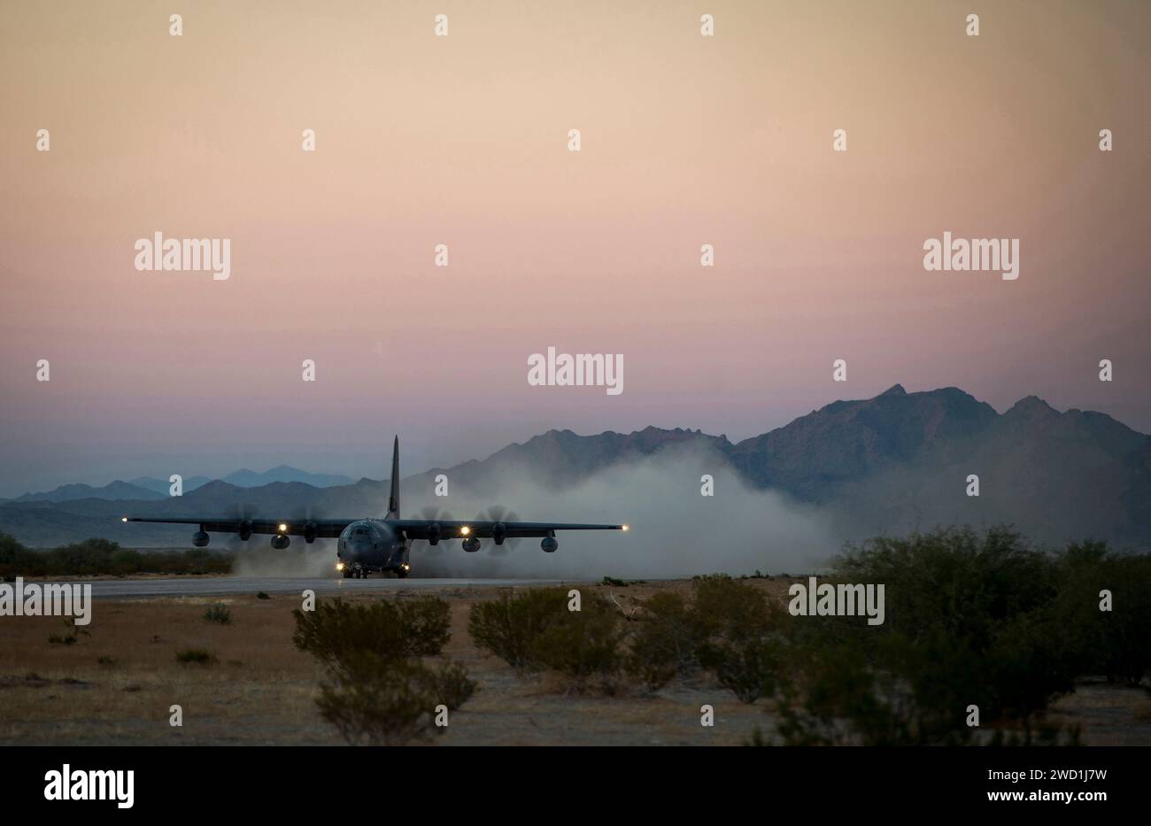 A U.S. Air Force C-130 Hercules lands on an expeditionary runway in Southern Arizona. Stock Photo