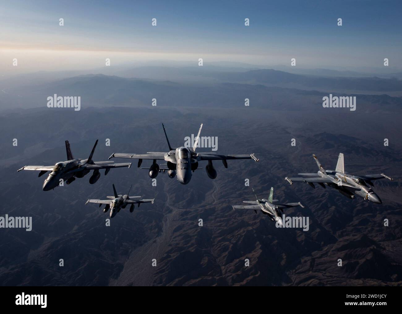 Military jets fly in a formation along the Pacific Coast in Southern California. Stock Photo