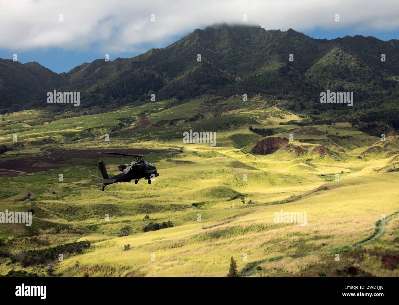 U.S. Army AH-64D Apache helicopter flies in formation over Schofield Barracks, Hawaii. Stock Photo