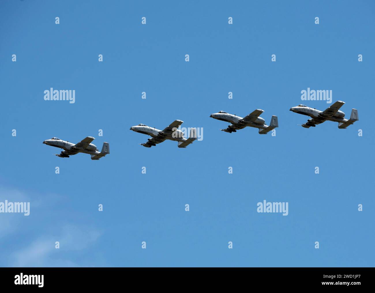 Four A-10 Thunderbolt IIs fly in formation. Stock Photo