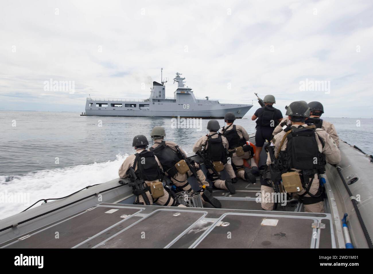 Sailors prepare to conduct a visit, board, search and seizure exercise with the Royal Brunei Navy Patrol Vessel Daruttaqwa. Stock Photo