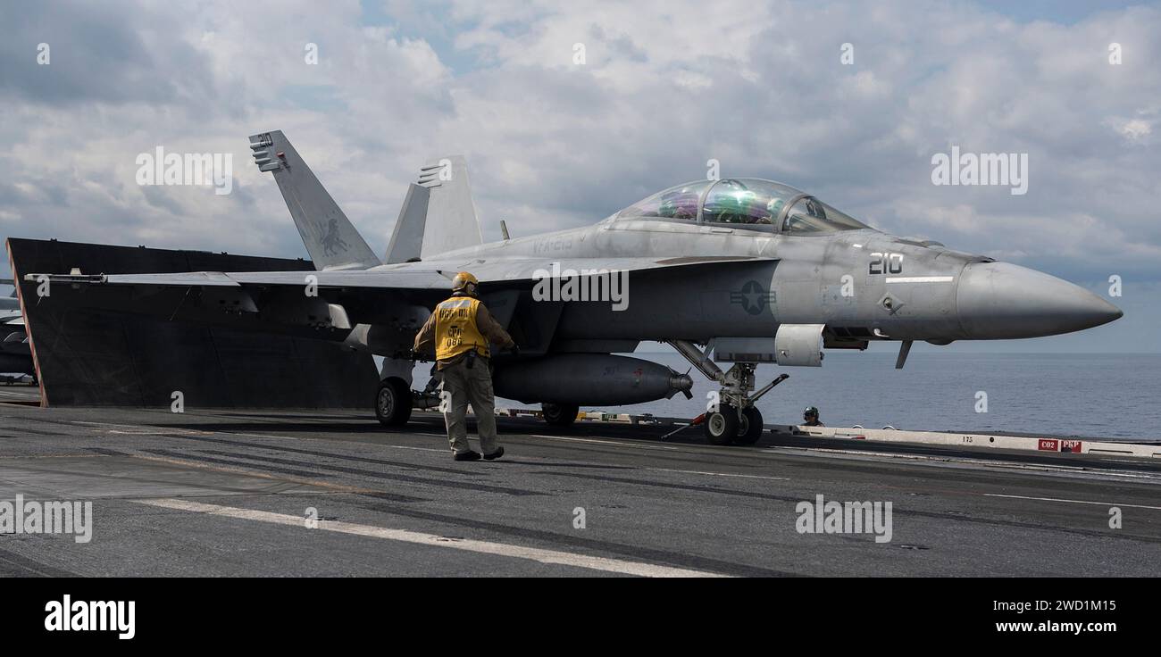 An F/A-18F Super Hornet prepares for launch aboard the aircraft carrier USS George H.W. Bush. Stock Photo