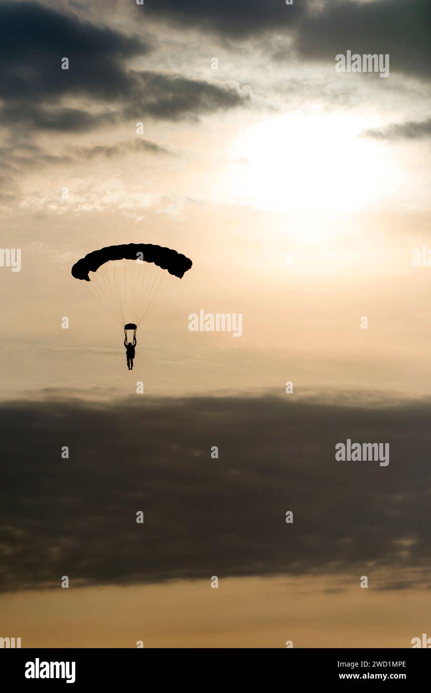 An Explosive Ordnance Disposal technician descends during military free-fall training in Suffolk, Virginia. Stock Photo