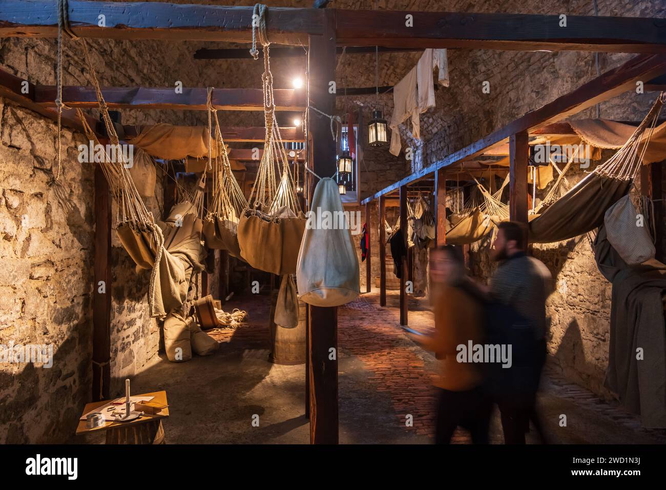 Prisons of War exhibition in Edinburgh Castle, Scotland, UK. Hammocks and bunk beds for pirates and prisoners of war in cramped vaults below Crown Squ Stock Photo