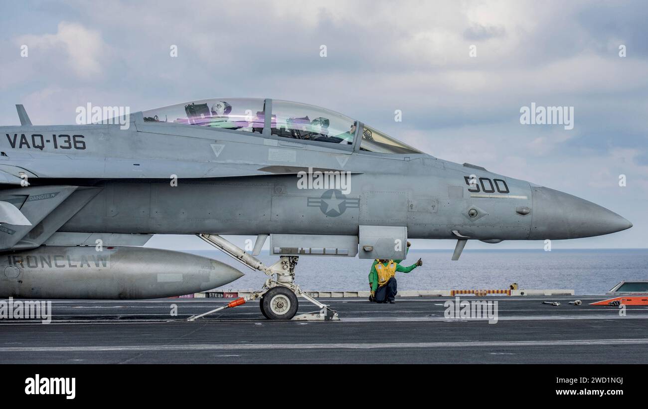 An E/A -18G Growler prepares to take off from the flight deck of USS Carl Vinson. Stock Photo