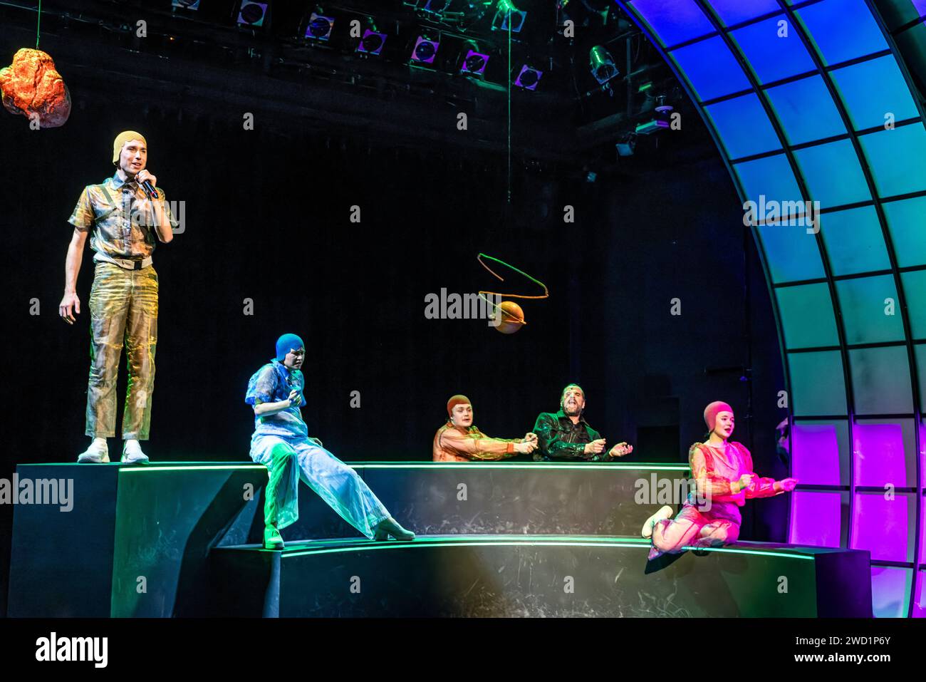 17 January 2024, Brandenburg, Cottbus: Actors Torben Appel (Lysander, l-r), Ariadne Pabst (Helena), Johannes Scheidweiler (Demetrius), Gunnar Golkowski (Puck) and Paula Aschmann (Hermia) stand on stage during a photo rehearsal for the play 'Rose and Rain, Sword and Wound'. Director Friederike Drews premieres a concentrated version of Shakespeare's 'A Midsummer Night's Dream' at the Cottbus Kammerbühne. Ev Benzing's stage design transforms the plot away from earthly crises and catastrophes and into the saving universe. Beat Fäh's 1989 Shakespeare adaptation ROSE AND RAIN, SWORD AND WOUND is bas Stock Photo