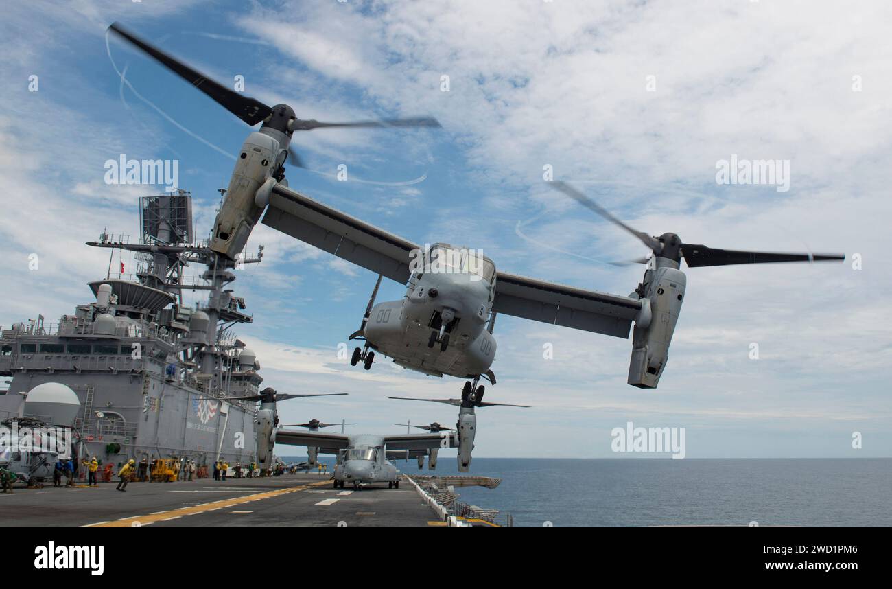 An MV-22 Osprey 162 takes off from the flight deck aboard the amphibious assault ship USS Iwo Jima. Stock Photo