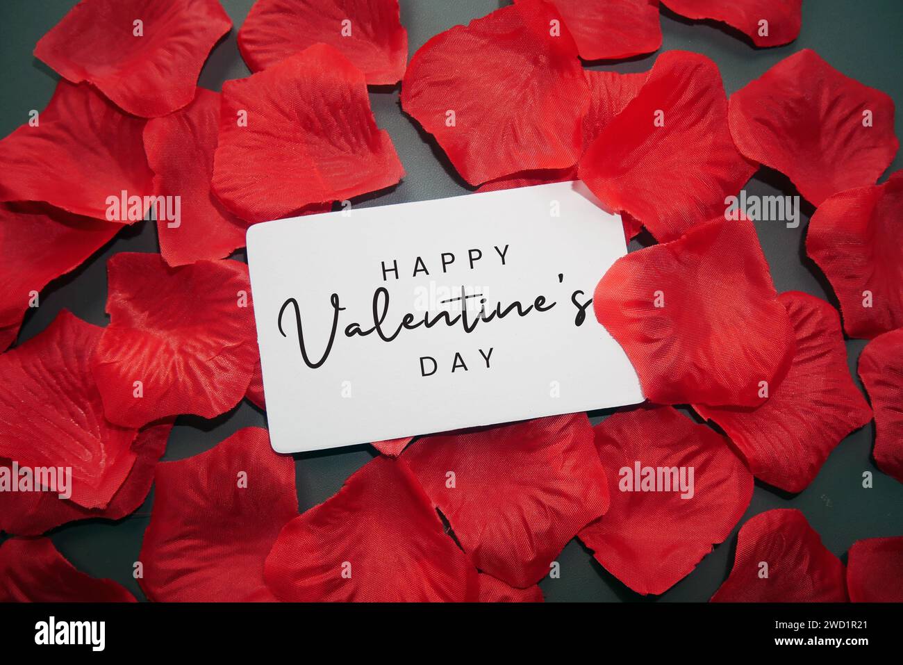 Happy Valentine's Day card with red rose petals sprinkled. Romantic ...