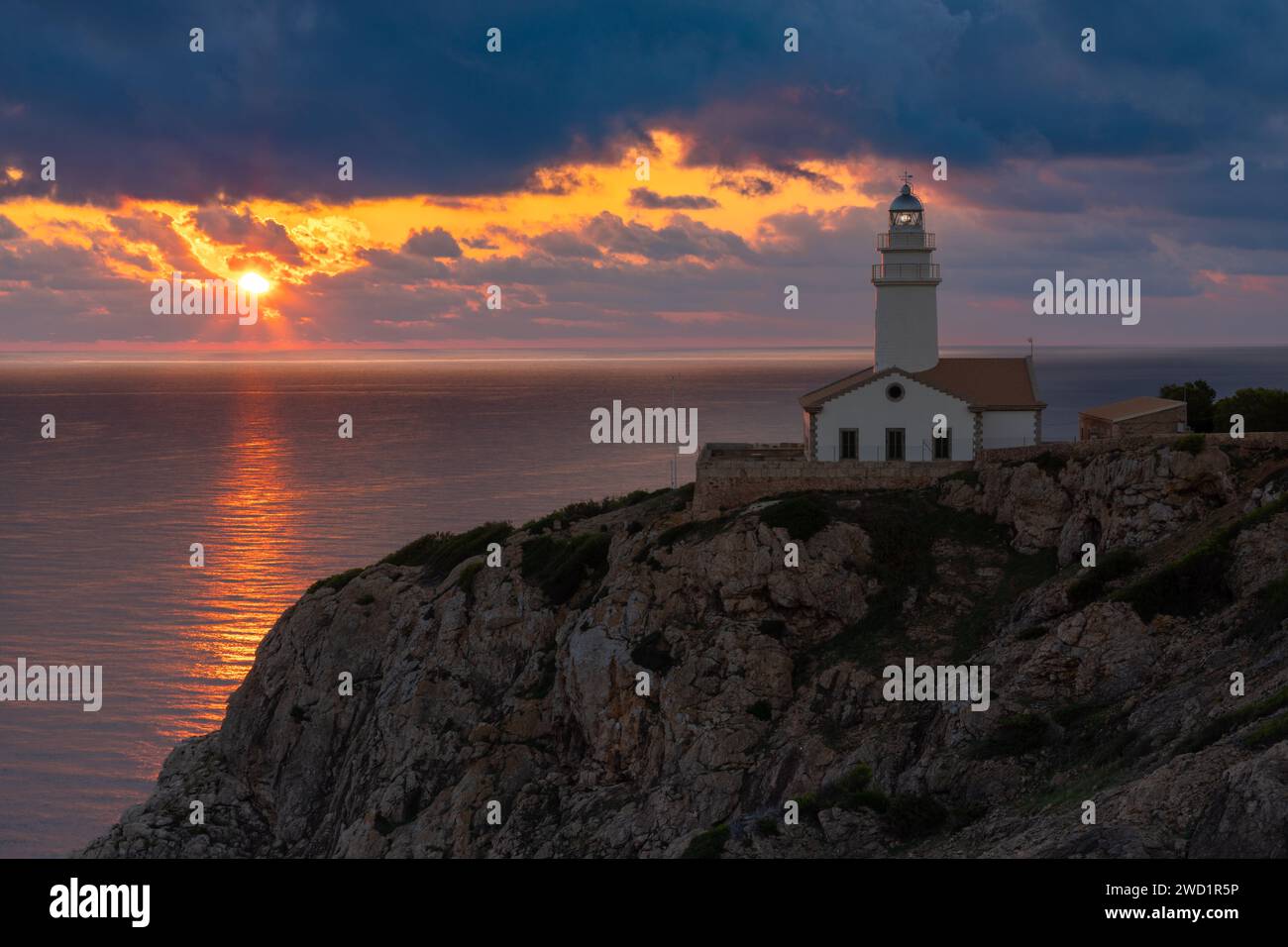 Sunrise at Capdepera lighthouse near Cala Rajada, island of Mallorca, Spain Stock Photo
