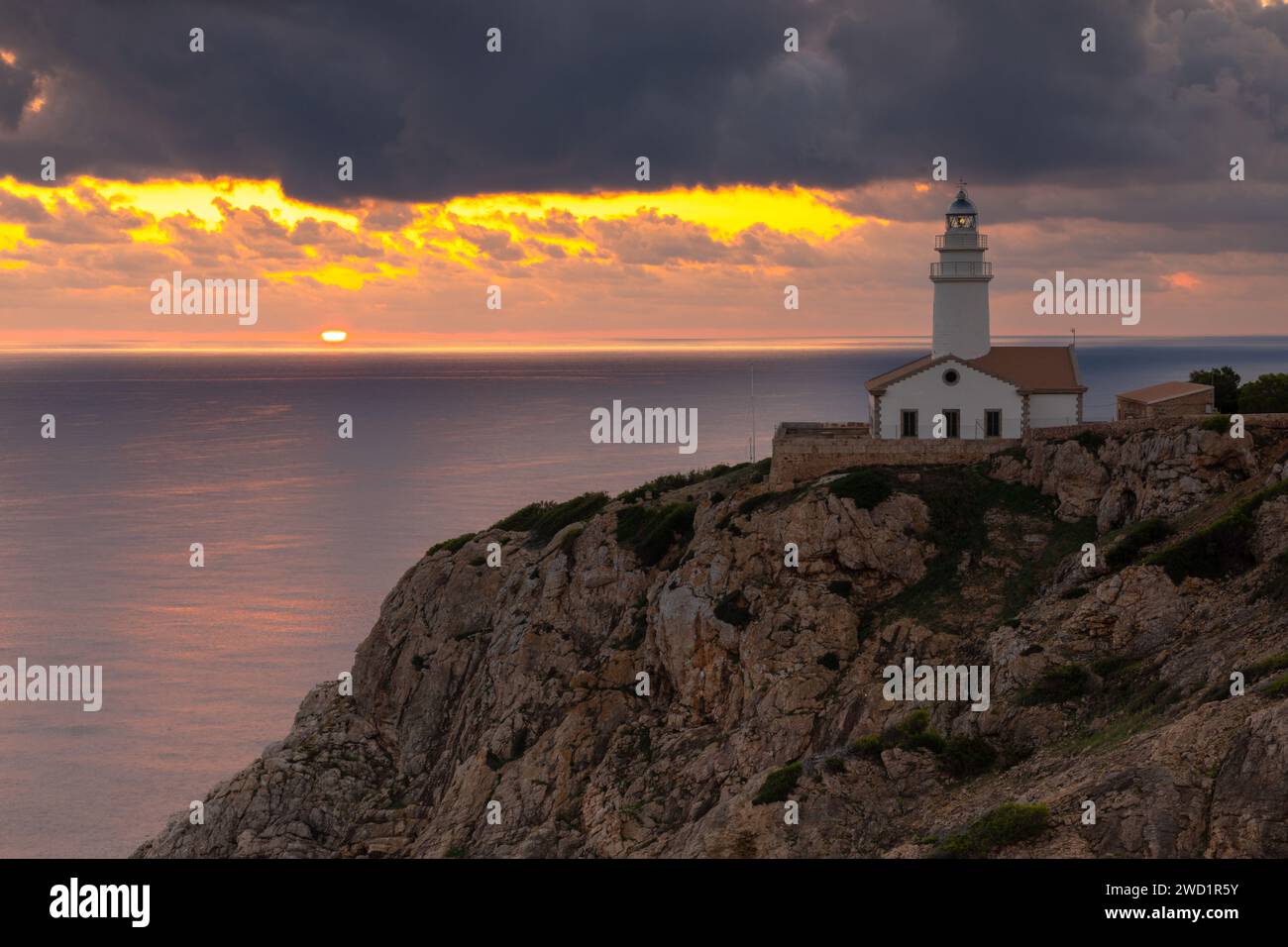 Sunrise at Capdepera lighthouse near Cala Rajada, island of Mallorca, Spain Stock Photo
