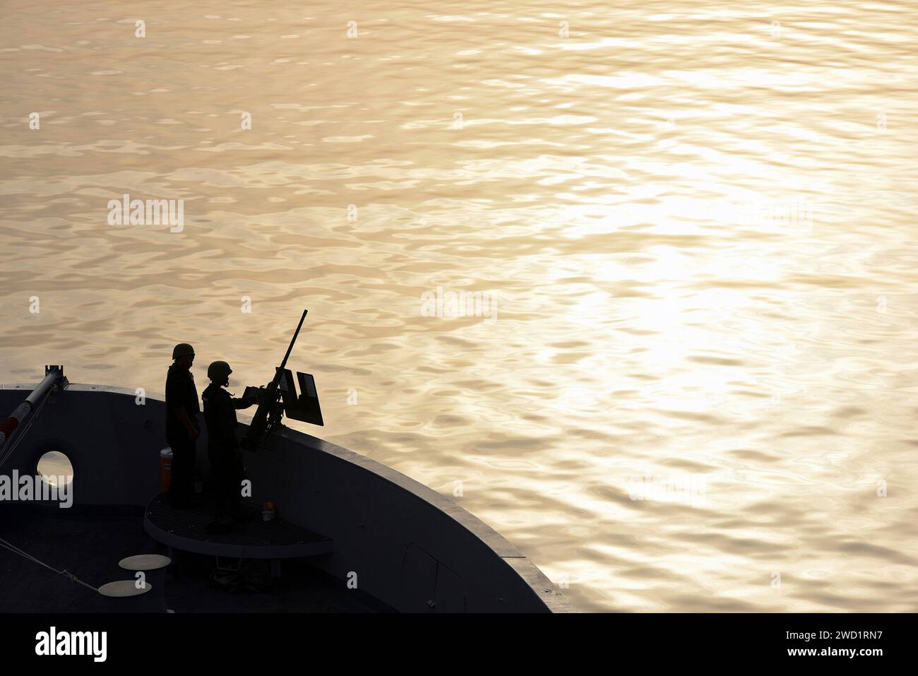 Sailors stand watch on the fo'c'sle of the amphibious transport dock ship USS San Diego. Stock Photo