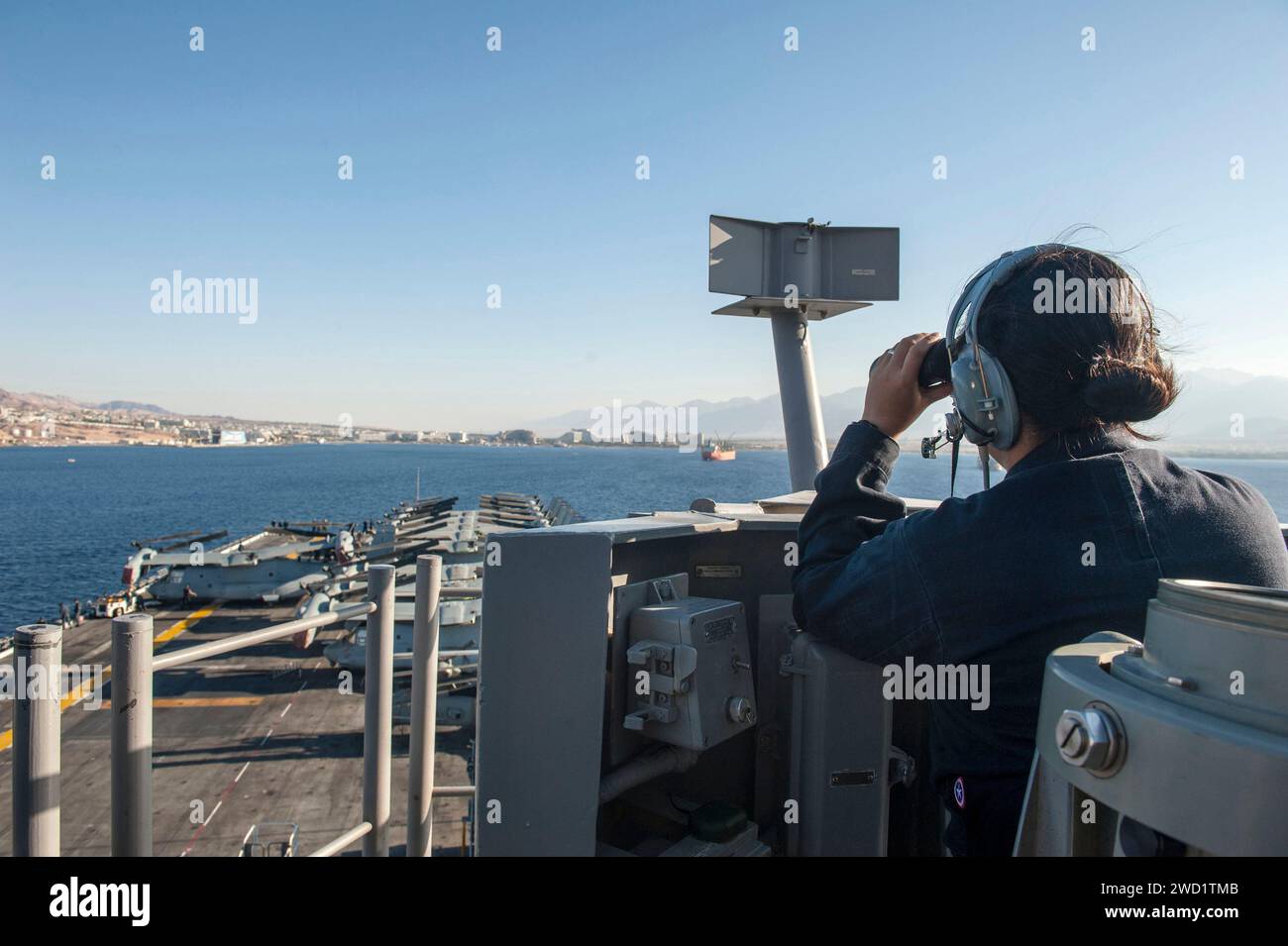 Seaman stands the forward lookout watch aboard USS America. Stock Photo