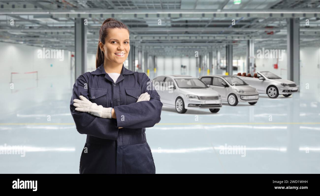 Young female worker in a car garage Stock Photo