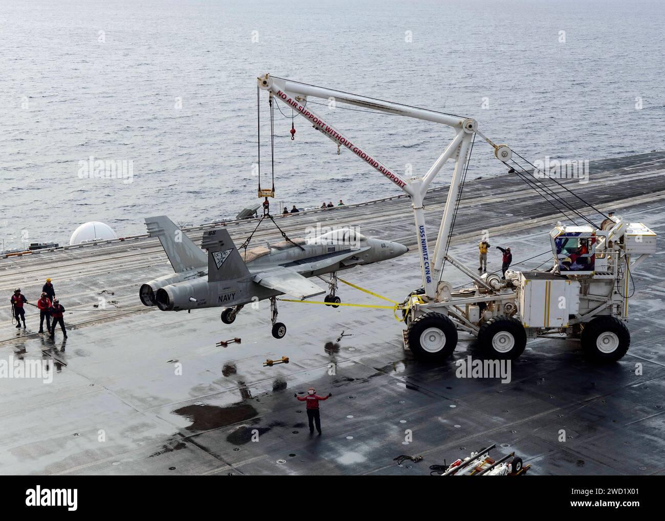 U.S. Navy Sailors demonstrate the operation of the mobile crash crane aboard USS Nimitz. Stock Photo